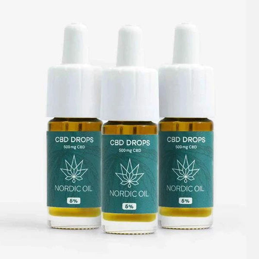 Three 10ml bottles of Nordic Öl CBD Öl Plus 5% with 500mg CBD displayed with white droppers on a white background